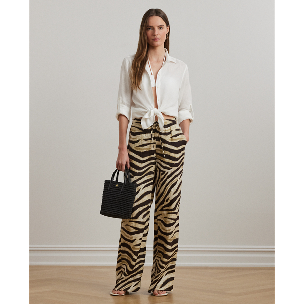 Crafted with airy linen for maximum comfort, these wide-leg drawcord trousers are refreshed with the season's eye-catching zebra print.