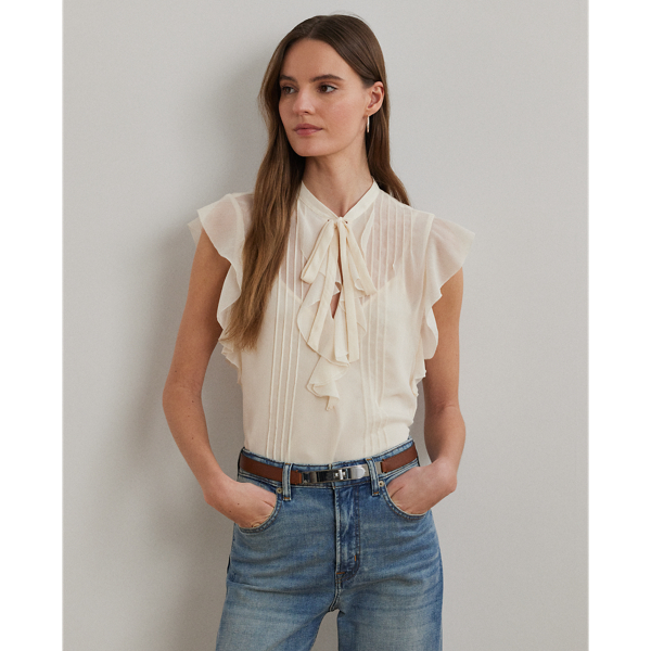 Airy, semi-sheer georgette beautifully complements this blouse's relaxed silhouette, ruffle-trimmed V-neck and flutter-sleeve design. Detailed with pintucks at the bodice, this style comes with a camisole lining for opacity.