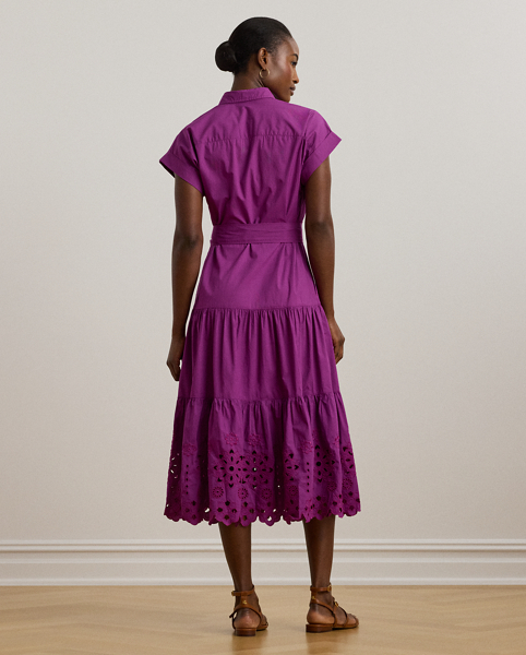 A fluid tiered skirt and eyelet embroidery add a feminine touch to this short-sleeve shirtdress, which is tailored with lightweight cotton broadcloth. Rolled cuffs and a belted waist complete the look.