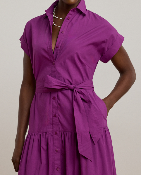 A fluid tiered skirt and eyelet embroidery add a feminine touch to this short-sleeve shirtdress, which is tailored with lightweight cotton broadcloth. Rolled cuffs and a belted waist complete the look.