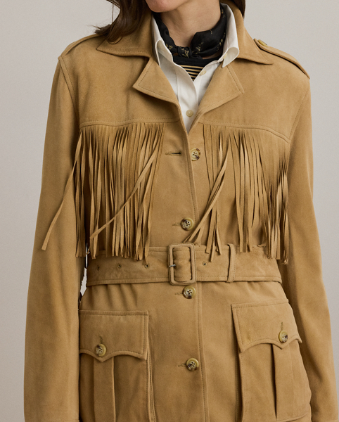 Fluid fringe trim brings a Western-inspired sensibility to this luxurious jacket, which is tailored from velvety soft goat suede. Buttoned shoulder epaulettes, a belted waist and signature horn-effect buttons complete the look.
