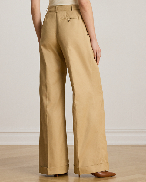 A timeless essential, these wide-leg trousers are detailed with front waist pleats, crisp creases and folded cuffs for a tailored look. This style is crafted from soft, lightweight cotton twill and has a signature horn-effect buttoned closure for a sophisticated finish.