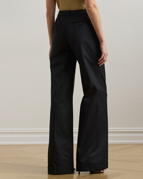 A timeless essential, these wide-leg trousers are detailed with front waist pleats, crisp creases and folded cuffs for a tailored look. This style is crafted from soft, lightweight cotton twill and has a signature horn-effect buttoned closure for a sophisticated finish.