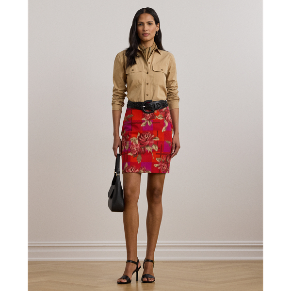 Crafted from a lightweight blend of linen and cotton, this pencil miniskirt showcases a vibrant floral-and-checked motif.