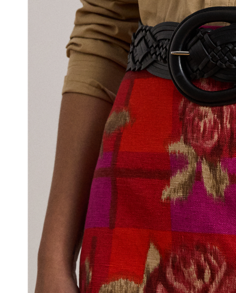 Crafted from a lightweight blend of linen and cotton, this pencil miniskirt showcases a vibrant floral-and-checked motif.