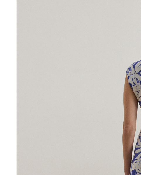 Crafted with smooth stretch jersey for a soft hand and fluid drape, this cap-sleeve dress depicts a palm-frond print in hues of white and blue.