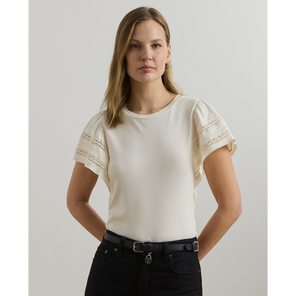 Crafted from soft jersey, this feminine crewneck top features flutter sleeves detailed with delicate lace insets.