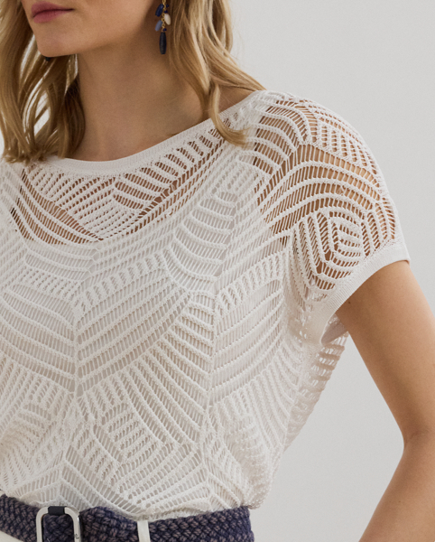 A geometric mesh stitch pattern brings dimension and visual intrigue to this jumper, which is perfect for transitional dressing thanks to its short-sleeve design and lightweight construction.