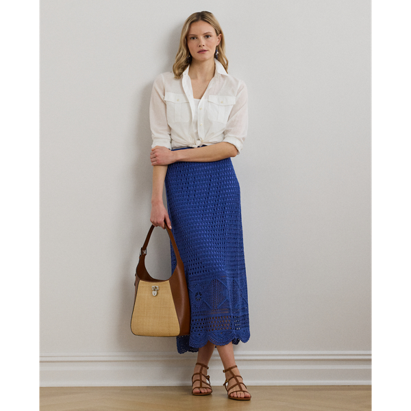 Spun with a lightweight linen-blend yarn, this A-line midi skirt is pointelle-knit to create a dimensional, open-worked pattern.