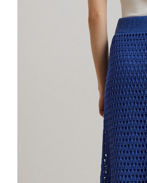 Spun with a lightweight linen-blend yarn, this A-line midi skirt is pointelle-knit to create a dimensional, open-worked pattern.