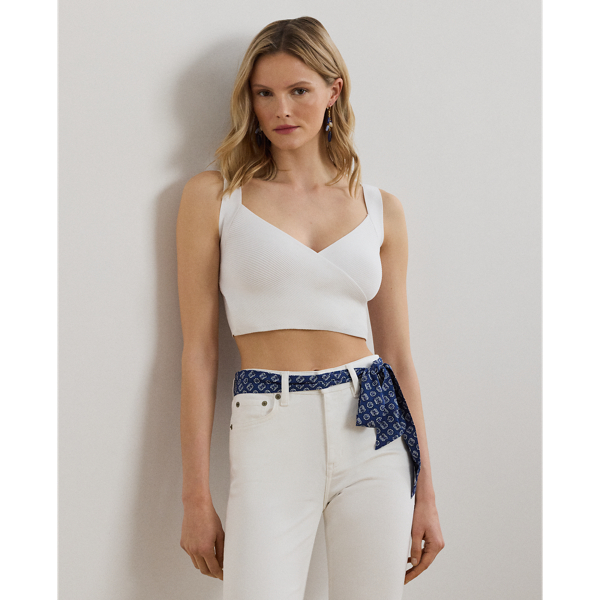 A modern essential, this cropped jumper tank top is defined by a flattering surplice neckline and a rib-knit construction.