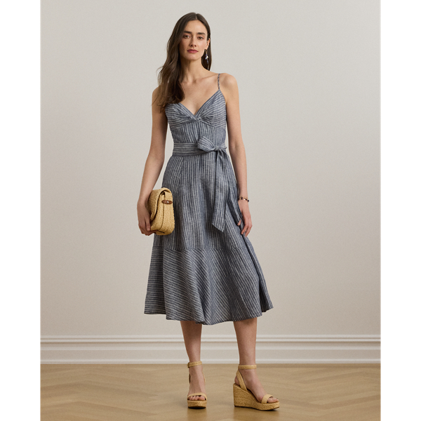 Crafted with lightweight linen, this sleeveless dress features a fit-and-flare silhouette complemented by a belted waist, slender yarn-dyed stripes and a twist-front bust.