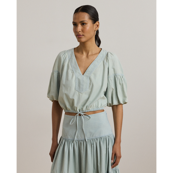 Crafted with lightweight cotton chambray, this effortless cropped blouse features voluminous bubble sleeves and an elasticised drawcord waist for a blouson effect.