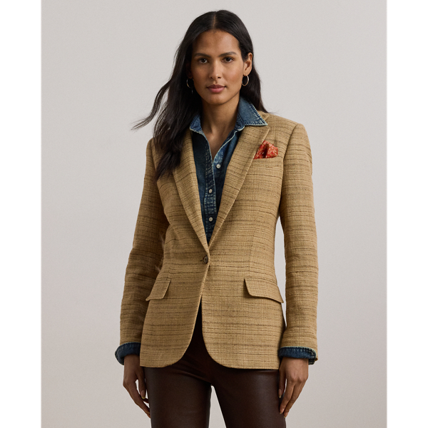 A wardrobe essential, this blazer is rendered in textured herringbone tweed spun with a lightweight blend that includes linen, cotton and silk. Shoulder pads, waist darts and panel seams heighten this style's refined sensibility.