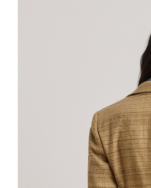 A wardrobe essential, this blazer is rendered in textured herringbone tweed spun with a lightweight blend that includes linen, cotton and silk. Shoulder pads, waist darts and panel seams heighten this style's refined sensibility.