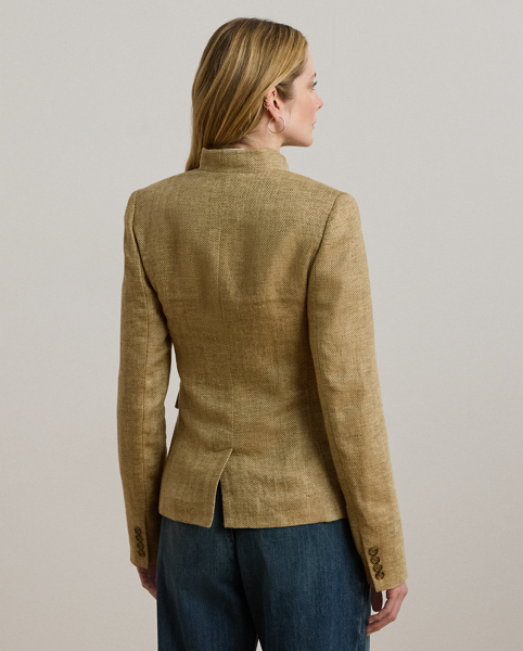 A sophisticated layer, this jacket unites a textured herringbone linen construction with surplus-inspired design elements, including a band collar, signature horn-effect buttons and box-pleated patch pockets.