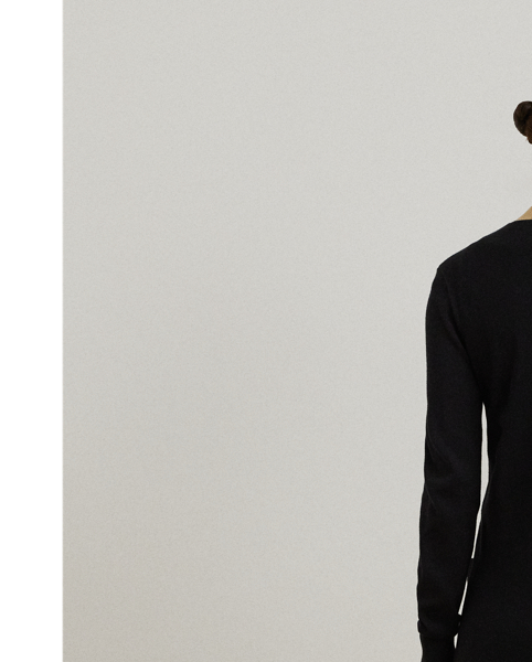 Crafted with a soft combed cotton blend, this calf-grazing cardigan showcases a two-tone design for a modern, sophisticated sensibility.