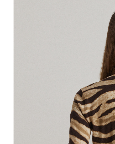 Crafted from a lightweight blend of linen and cotton for a soft hand feel, this V-neck cardigan showcases an eye-catching zebra print.