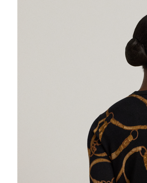 Made with a soft cotton blend for a comfortable feel, this slim-fitting crewneck jumper showcases the season's equestrian-inspired belting print.