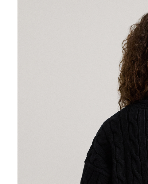 Crafted with ultrasoft combed cotton, this monochromatic version of Lauren  Ralph Lauren Lauren's iconic cricket jumper features a cable-knit body detailed with delicate pointelle stitching along the neckline.