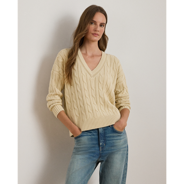Crafted with ultrasoft combed cotton, this monochromatic version of Lauren  Ralph Lauren Lauren's iconic cricket jumper features a cable-knit body detailed with delicate pointelle stitching along the neckline.