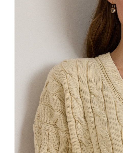 Crafted with ultrasoft combed cotton, this monochromatic version of Lauren  Ralph Lauren Lauren's iconic cricket jumper features a cable-knit body detailed with delicate pointelle stitching along the neckline.