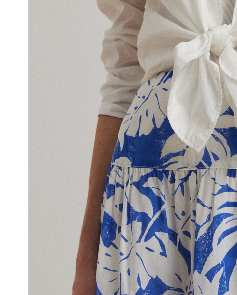 Showcasing the season's palm-frond print in hues of white and blue, this A-line skirt unites lightweight cotton voile with a tiered construction for effortless movement with each step.
