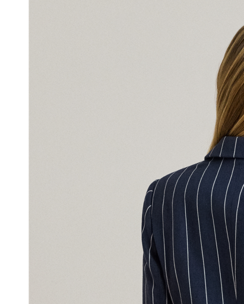 An enduring layering piece, this double-breasted blazer is crafted from a herringbone linen blend for subtle texture and a lightweight feel. Shoulder pads, waist darts and panel seams accentuate its streamlined silhouette, while peak lapels and signature horn-effect buttons add a sophisticated finish.