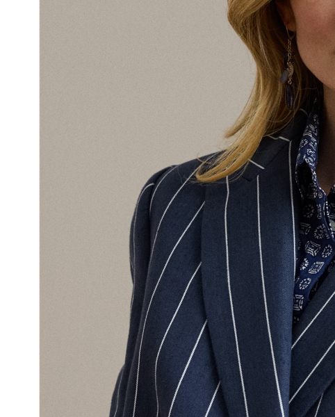 An enduring layering piece, this double-breasted blazer is crafted from a herringbone linen blend for subtle texture and a lightweight feel. Shoulder pads, waist darts and panel seams accentuate its streamlined silhouette, while peak lapels and signature horn-effect buttons add a sophisticated finish.