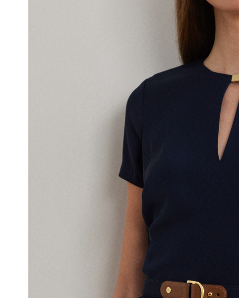 Detailed with a signature plaque on the neck, this fit-and-flare dress is rendered in silky georgette for a luxurious hand and sweeping movement. A faux-leather "LRL"-engraved buckled self-belt completes the look.