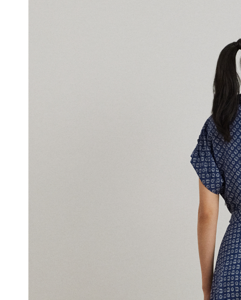 Crafted from airy crepe de Chine, this dress balances a spread collar and roll-tab sleeves with a feminine surplice neckline to create a look that is casual yet refined. Detailed with "LRL"-engraved buttons, this version displays the season's stylised geometric print.