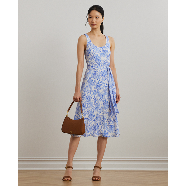Crafted with bubble crepe for an airy look and feel, this sleeveless dress showcases a blue-and-white floral motif rendered in the style of an ink sketch. This style is finished with a self-belt that accentuates the waist.