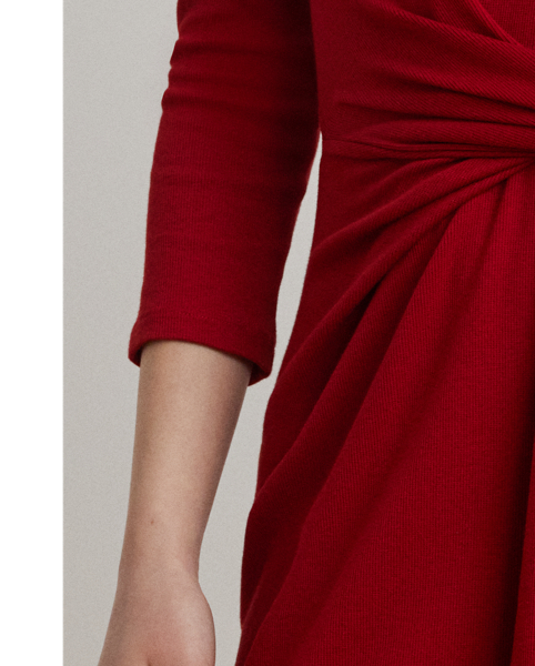 Rib-knit with a soft stretch-cotton blend, this long-sleeve crewneck dress is cut for a slim-fitting silhouette and a calf-grazing midi length. A tie-front design at the waist adds contemporary flare, while a skirt slit affords ease of movement.