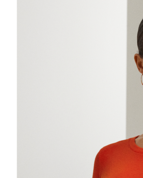 Rib-knit with a soft stretch-cotton blend, this long-sleeve crewneck dress is cut for a slim-fitting silhouette and a calf-grazing midi length. A tie-front design at the waist adds contemporary flare, while a skirt slit affords ease of movement.