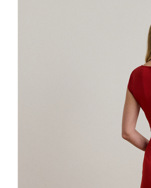 Rendered in smooth stretch jersey for ease of movement, this elegant cap-sleeve dress showcases a figure-skimming sheath silhouette and a pleated wrap-style overlay that gathers into a bamboo-inspired, textured metal O-ring at the waist.