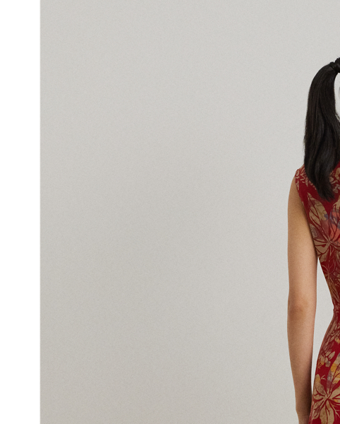 An eye-catching twist-front detail on the bodice serves as the focal point of this cap-sleeve dress, which is crafted from stretch-infused jersey for a soft feel and ease of movement. This version displays a painterly floral motif against a vibrant red backdrop.