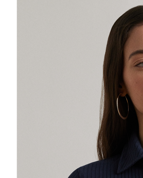 Lauren  Ralph Lauren Lauren reimagines the iconic Polo shirt as a slim-fitting midi dress with elbow-length sleeves and a rib-knit construction.