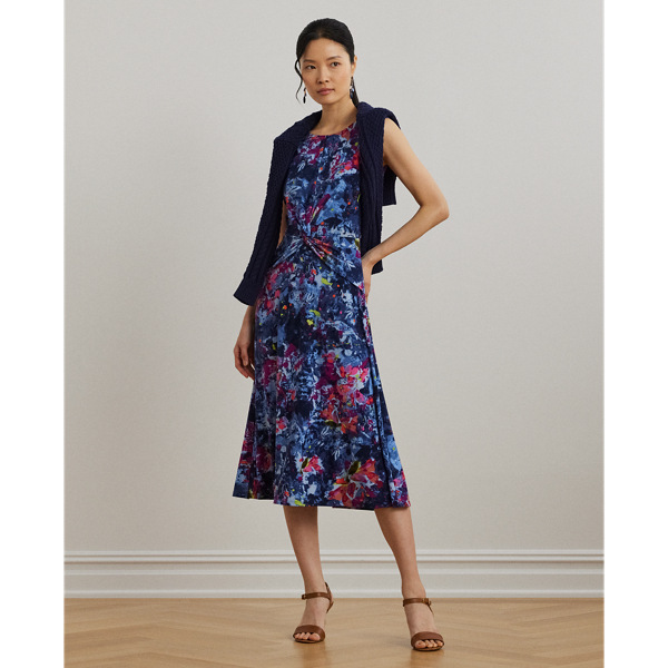 An eye-catching twist-front detail on the bodice serves as the focal point of this cap-sleeve dress, which is crafted from stretch-infused jersey for a soft feel and ease of movement. This version highlights the season's painterly abstract motif.