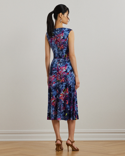 An eye-catching twist-front detail on the bodice serves as the focal point of this cap-sleeve dress, which is crafted from stretch-infused jersey for a soft feel and ease of movement. This version highlights the season's painterly abstract motif.