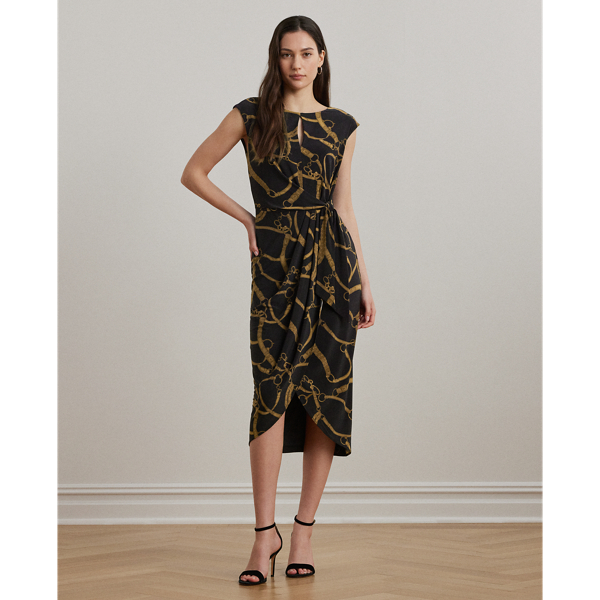 A faux wrap skirt, pleats and a keyhole at the neckline lend to the effortless beauty of this cap-sleeve dress. Crafted from soft stretch jersey, this version showcases the season's equestrian-inspired belting print.