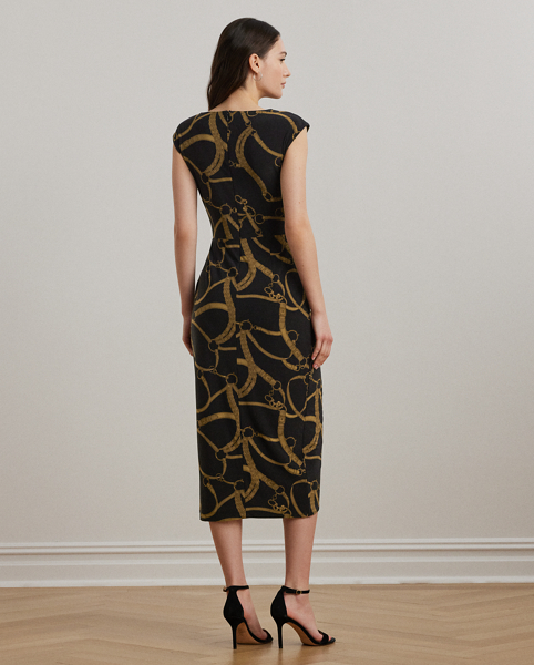 A faux wrap skirt, pleats and a keyhole at the neckline lend to the effortless beauty of this cap-sleeve dress. Crafted from soft stretch jersey, this version showcases the season's equestrian-inspired belting print.