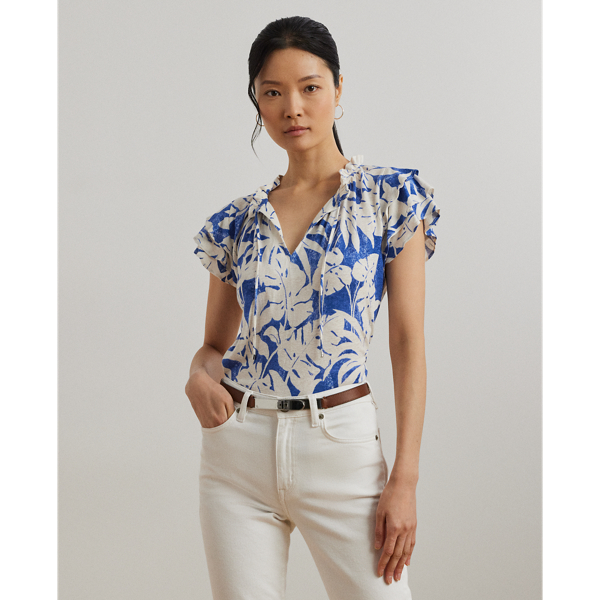 Crafted with lightweight linen-blend jersey, this tie-neck top is characterised by flutter sleeves, ruffle trim and the season's palm-frond print in hues of white and blue.