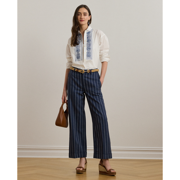 Slender, yarn-dyed stripes accentuate the wide-leg silhouette of these cropped trousers, which are crafted from a herringbone linen blend for a lightweight feel and subtle texture. Crisp creases and waist darts offer a tailored finish.
