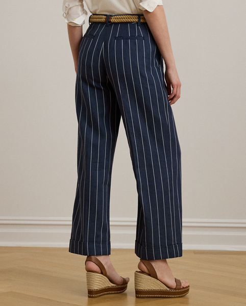 Slender, yarn-dyed stripes accentuate the wide-leg silhouette of these cropped trousers, which are crafted from a herringbone linen blend for a lightweight feel and subtle texture. Crisp creases and waist darts offer a tailored finish.