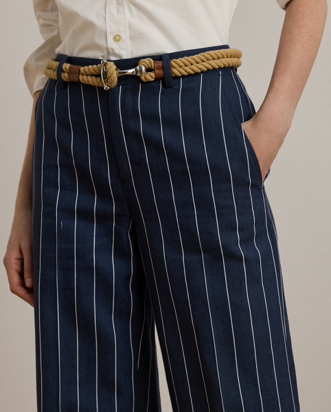 Slender, yarn-dyed stripes accentuate the wide-leg silhouette of these cropped trousers, which are crafted from a herringbone linen blend for a lightweight feel and subtle texture. Crisp creases and waist darts offer a tailored finish.