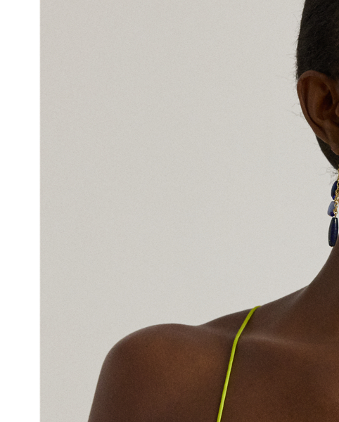 Crisscross straps bring a contemporary touch to this knee-length slip dress, which is crafted with featherweight satin charmeuse for a luminous sheen and a lightweight feel.