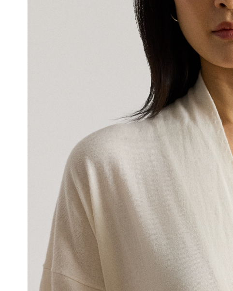 Elegant and cosy, this relaxed-fitting jumper unites a surplice design with a soft cotton-and-modal blend.