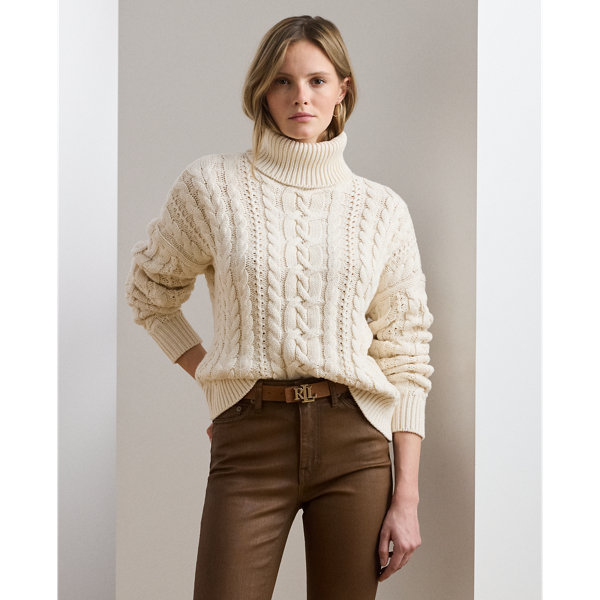 A timeless cold-weather staple, this roll neck jumper showcases a relaxed-fitting, cable-knit silhouette in a soft cotton blend.