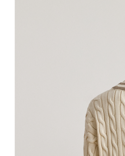 Distinguished by its contrast stripes and cable-knit pattern, this version of Lauren  Ralph Lauren Lauren's iconic cricket jumper is crafted with ultrasoft combed cotton. An "LRL"-embroidered logo on the hem completes the look.