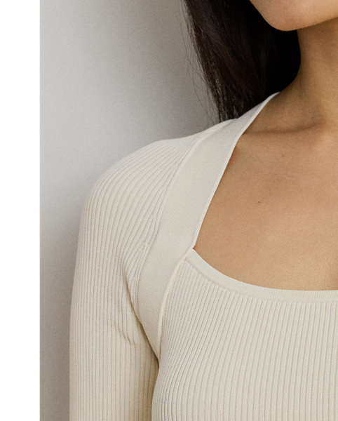 Modern elegance defines this jumper, which features a rib-knit construction, a square neckline and an equestrian-inspired buckle embellishment at the left shoulder.